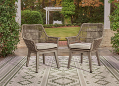 Beige Resin-Wicker Outdoor Dining Armchairs with Cushions — Set of 2, pair in an outdoor setting; other items not included - 2