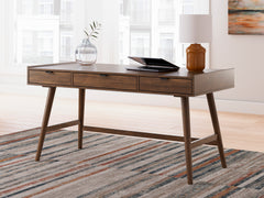 Brown mid-century desk with three drawers — styled room view; other items not included - 2