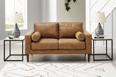 Caramel Upholstered Seating, loveseat room setting; tables and decor excluded - 10