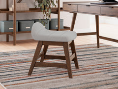 Light gray upholstered desk chair with brown hardwood frame — styled room view; other items not included - 8