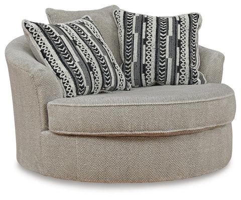 Sisal Beige Oversized Swivel Chair with Patterned Pillows