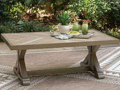 Beige, outdoor coffee table in a patio setting - 2