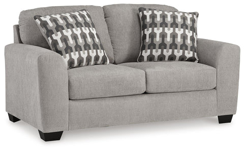 Textured Loveseat with Patterned Pillows in Flannel