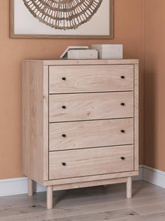Tan / Light Oak-Look Four-Drawer Chest with Black Knobs — room setting; accessories not included - 4