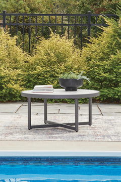 Gray, coffee table in outdoor setting; accessories excluded - 2