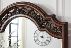 Brown, ornate scrollwork detail - 2