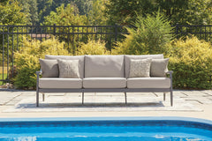Gray, sofa in outdoor setting - 2