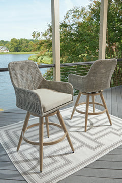 Beige/Gray, pair of bar stools in an outdoor setting - 2
