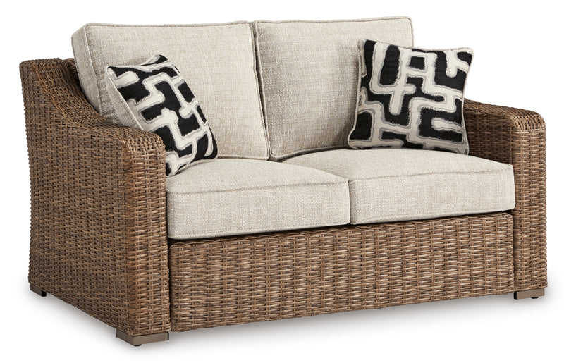Beige Wicker Outdoor Loveseat with Cushions and Two Pillows