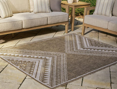 Brown/Cream 5' x 7', rug in an outdoor setting - 2