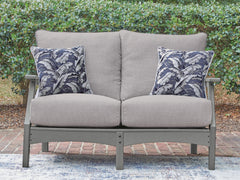 Gray, loveseat in outdoor setting - 2
