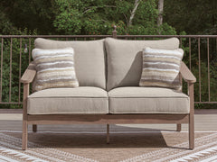 Natural/Gray, outdoor loveseat in a patio setting - 2