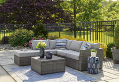 Gray, outdoor sectional set in a patio setting - 2